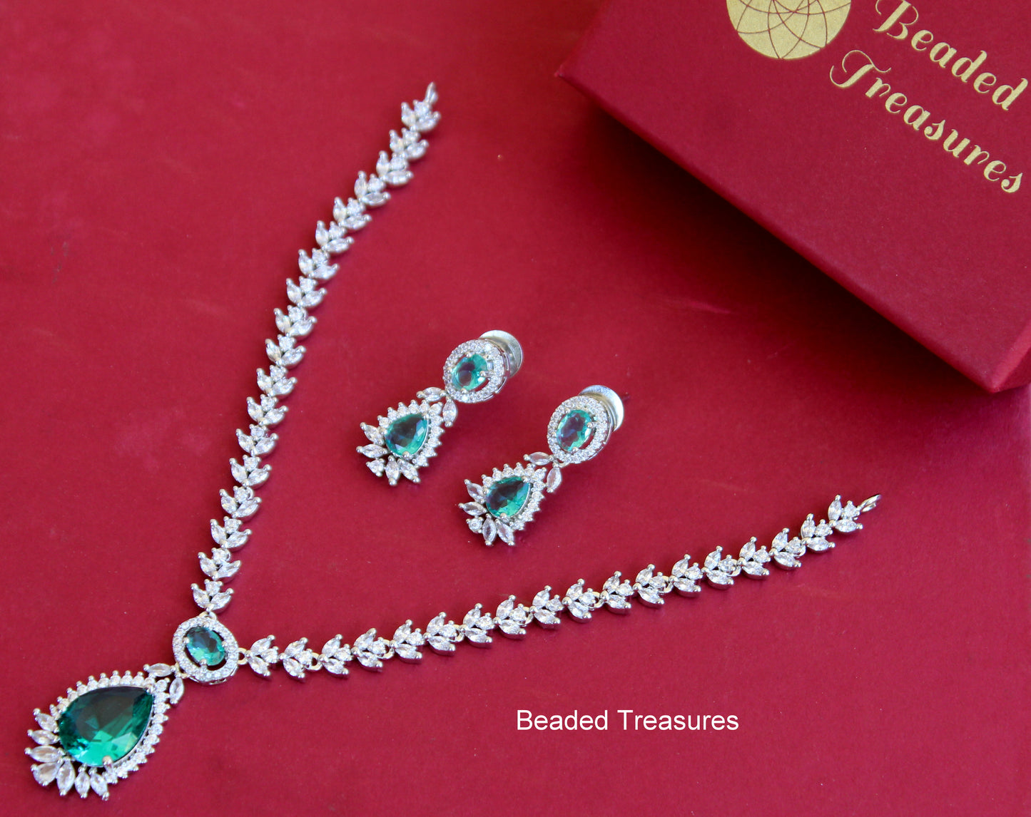 Anshi Art American Diamond Drop Necklace Set with Green Stones - Beaded Treasures