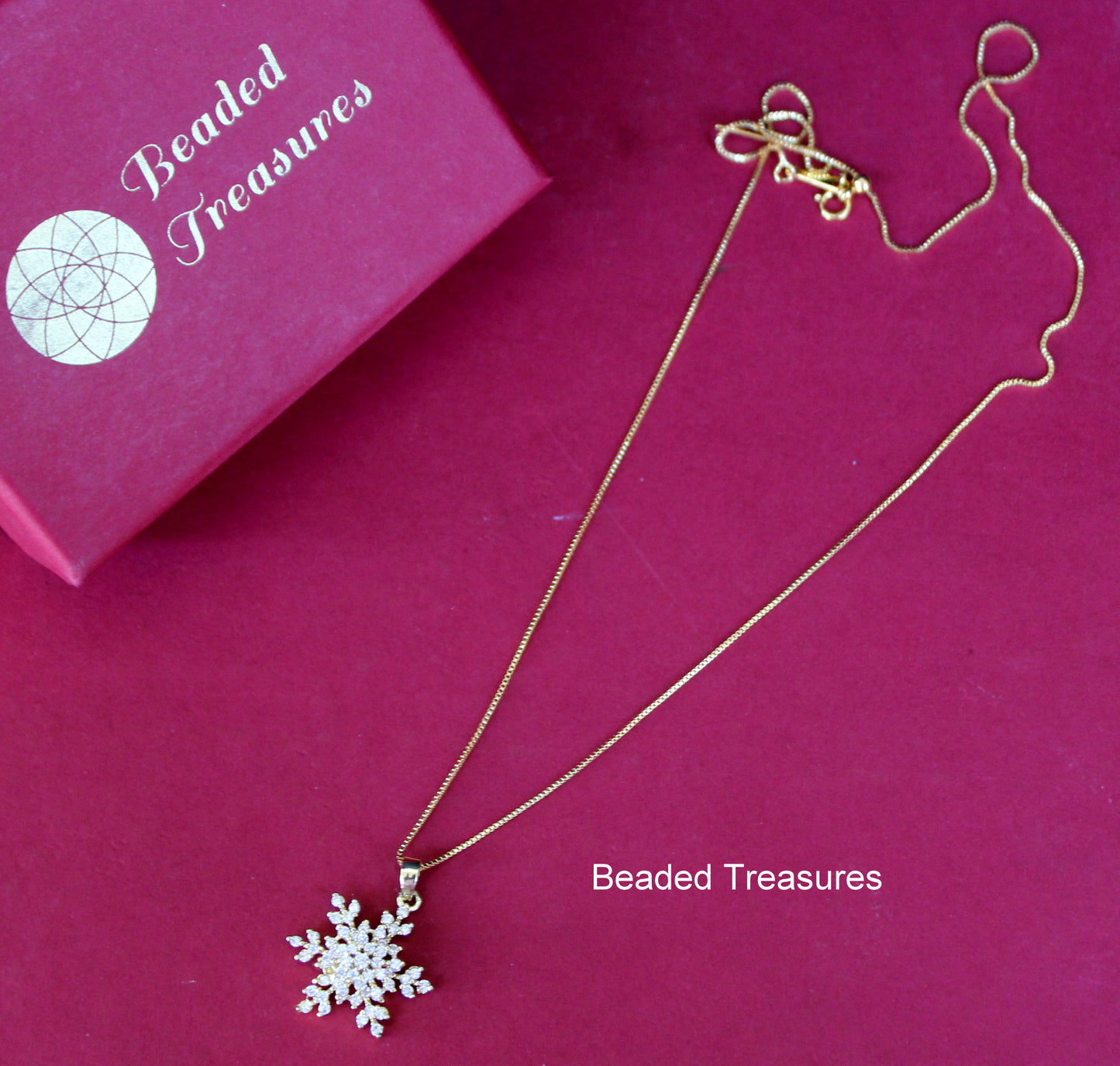 Gold-Toned Snowflake Pendant Necklace - Beaded Treasures