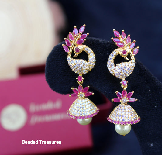 Gold-Toned Peacock Design Jhumka Earrings with Pearl Drops - Beaded Treasures