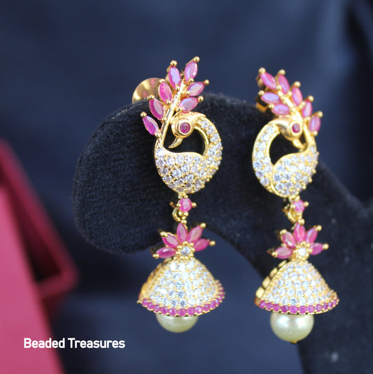 Gold-Toned Peacock Design Jhumka Earrings with Pearl Drops - Beaded Treasures