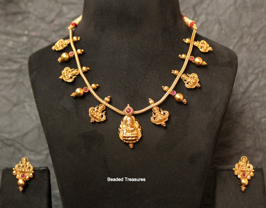 Elegant Matte Gold Finish Lakshmi Devi Necklace Set with Earrings - Beaded Treasures